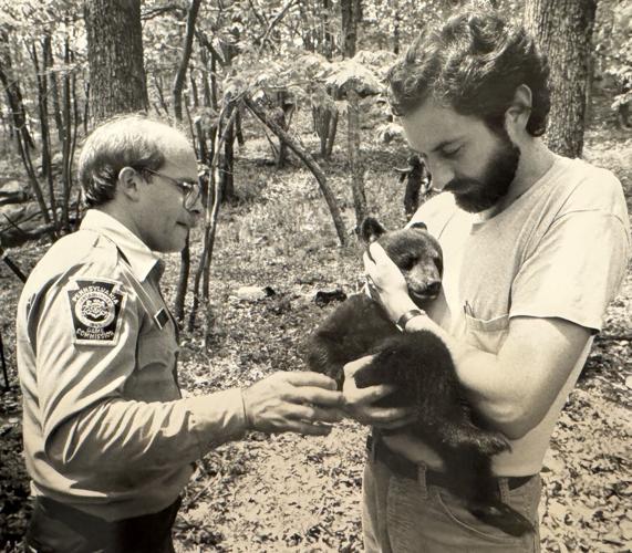 Out outdoors farewell column Ad with bear cub and Gary Alt D22.jpg