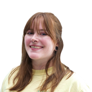 Headshot of a smiling woman, long reddish hair with bangs.