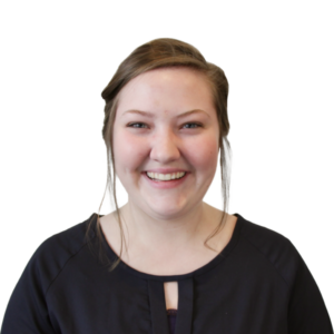 Headshot of a smiling woman with a black blouse.