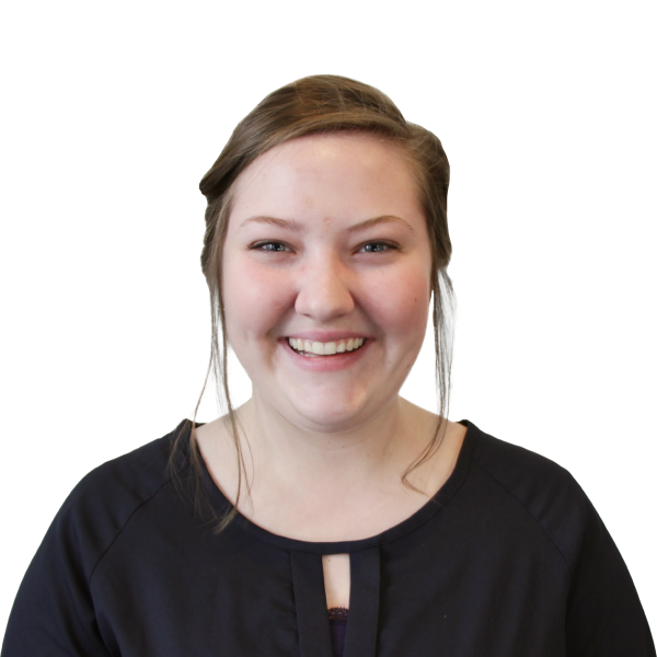 Headshot of a smiling woman with a black blouse.