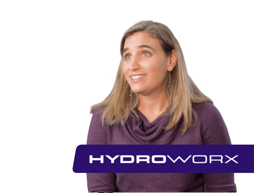 Mujer de morado, mirando a la derecha, logotipo HYDROWORX debajo.