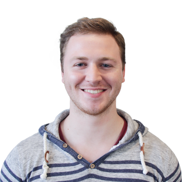 Headshot of a cheerful man in striped hoodie, clear background.